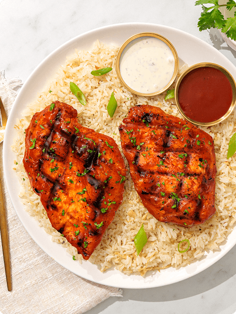 Plated grilled chicken meal