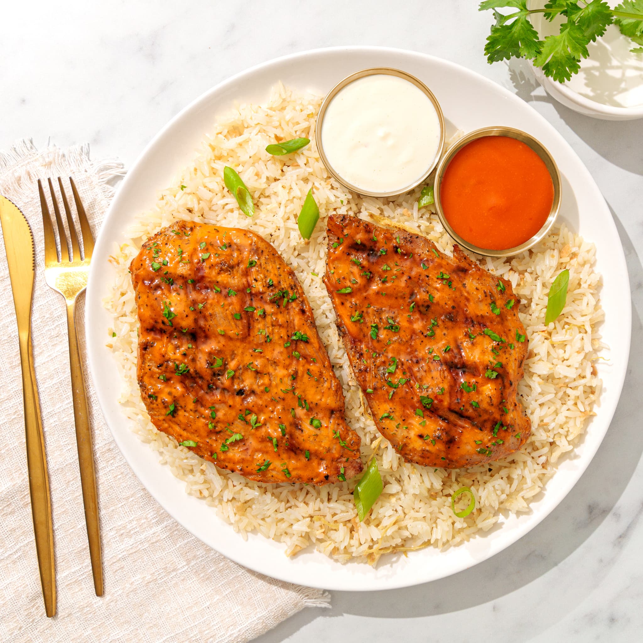 Honey buffalo grilled chicken breasts over rice